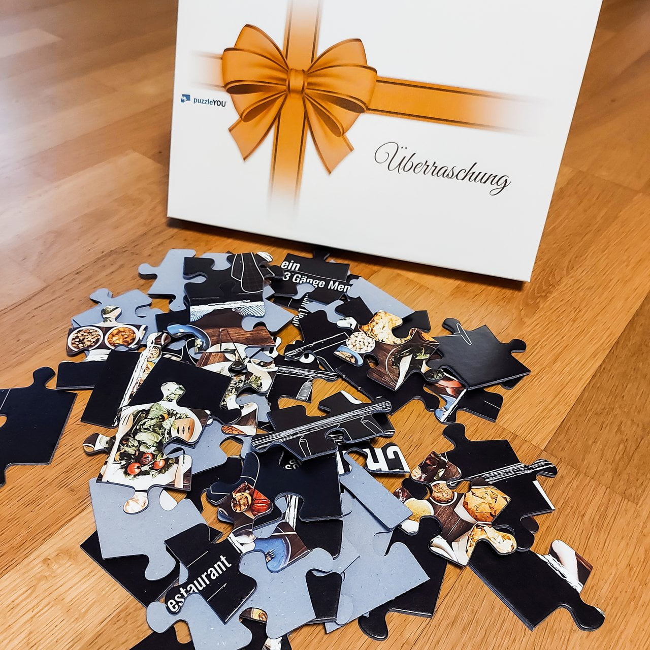 Ein besonderes Highlight: Das puzzleYOU-Gutscheinpuzzle in der Überraschungs-Puzzleschachtel